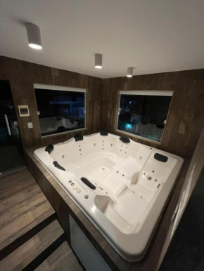 Casa agradável em frente a praia com jacuzzi/spa